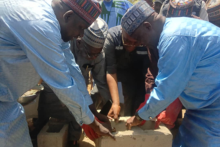 WR performing the symbolic foundation laying ceremony of the Monguno Specialist Hospital expansion project with other dignitaries