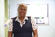 Mildred outside her consultation room at FF Rebeiro Clinic