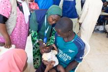 Child being vaccinated at a health care facility