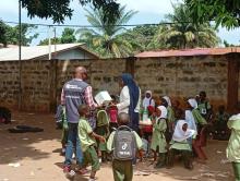 A WHO officer supports health workers during the MR vaccination exercise at a school in Bakau, ensuring every eligible child is reached.