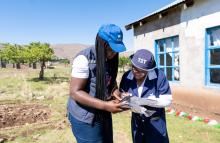 WHO communications officer interacting with the village health workers at Praise Preschool in Mokhotlong