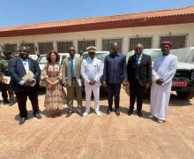 Representatives of WHO, UNDP and UNICEF stand alongside the Minister of Public Health and the Prime Minister of Guinea-Bissau during an official handover ceremony of health equipment and medical supplies.