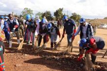 WHO Malawi staff took to the field for a hands-on clean-up exercise at Phwetekere Market
