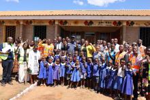 The team posed with children at Kabudula Primary School