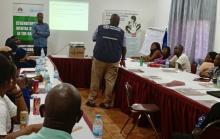 WHO staff member, Dr. Ifeanyi Udenweze, facilitates an interactive role-play session during the mhGAP training.