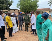 WHO and partners meeting with health personnel during a field visit.