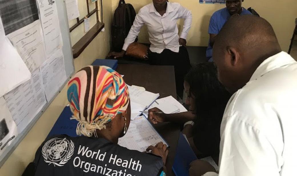 Dr Fatoumata Keita converses with medical personnel
