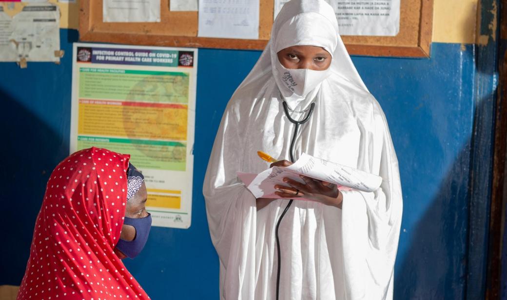 Volunteer student nurse, Hassana Hussaini  taking patient’s relevant demographic information.