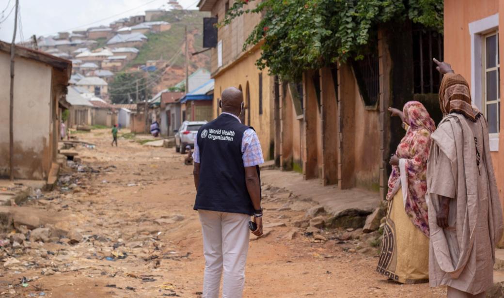 WHO personnel speaks to community members during a recent HBC visit to the Agwan Rogo community in Plateau state.