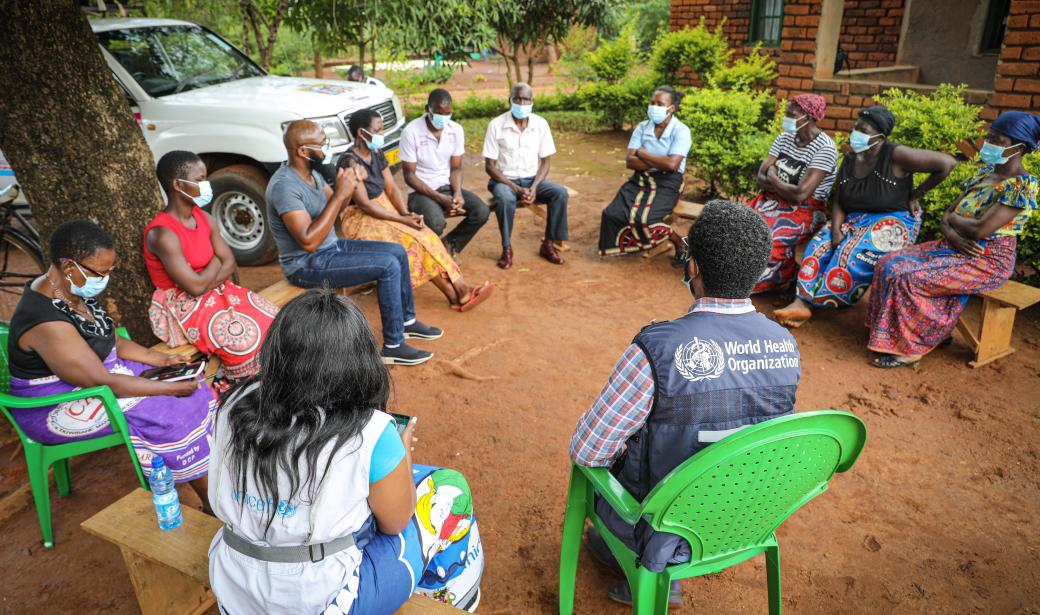 Mr Chipiliro Mjojo, in local language, Chichewa, with support from Elsie Chitedze (UNICEF Malawi programme associate in health) and Fitwi Meles (WHO Stop Transmission of Polio consultant) to ensure a successful vaccination roll out in the community