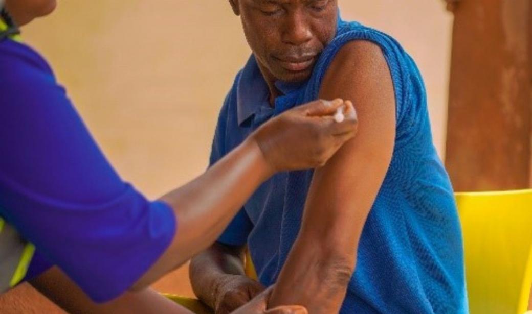 Usman Idris, receiving his booster dose