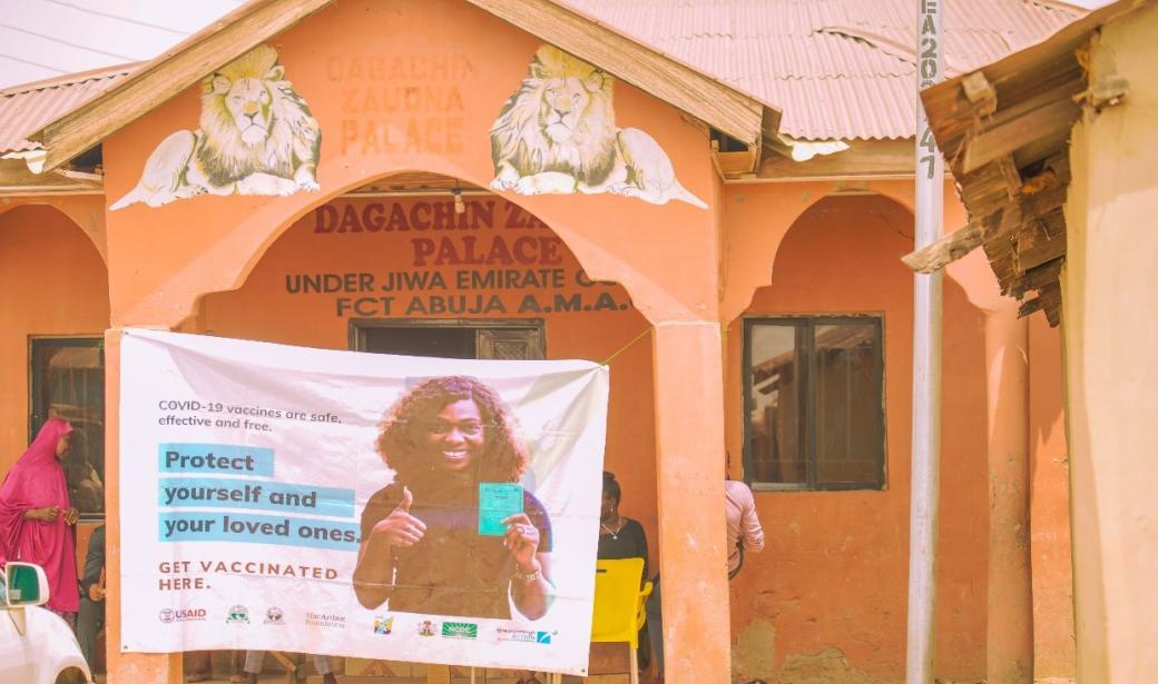 The vaccinators and residents at the vaccination post in front of the palace of the District Head of Zanda, Abuja.