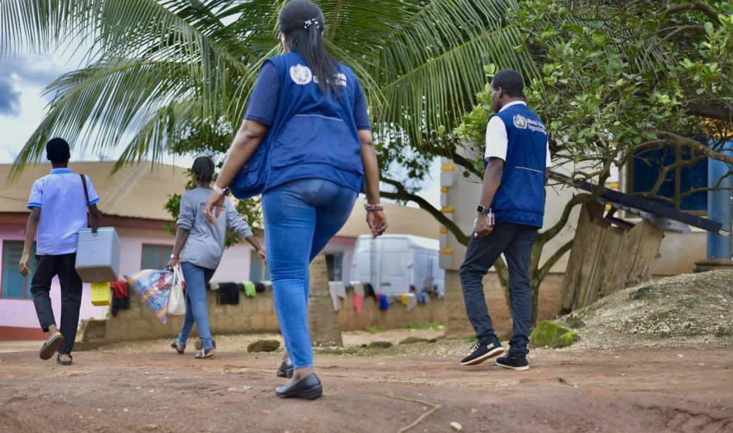 A dedicated volunteer assisting the team in vaccinating every child in the community.