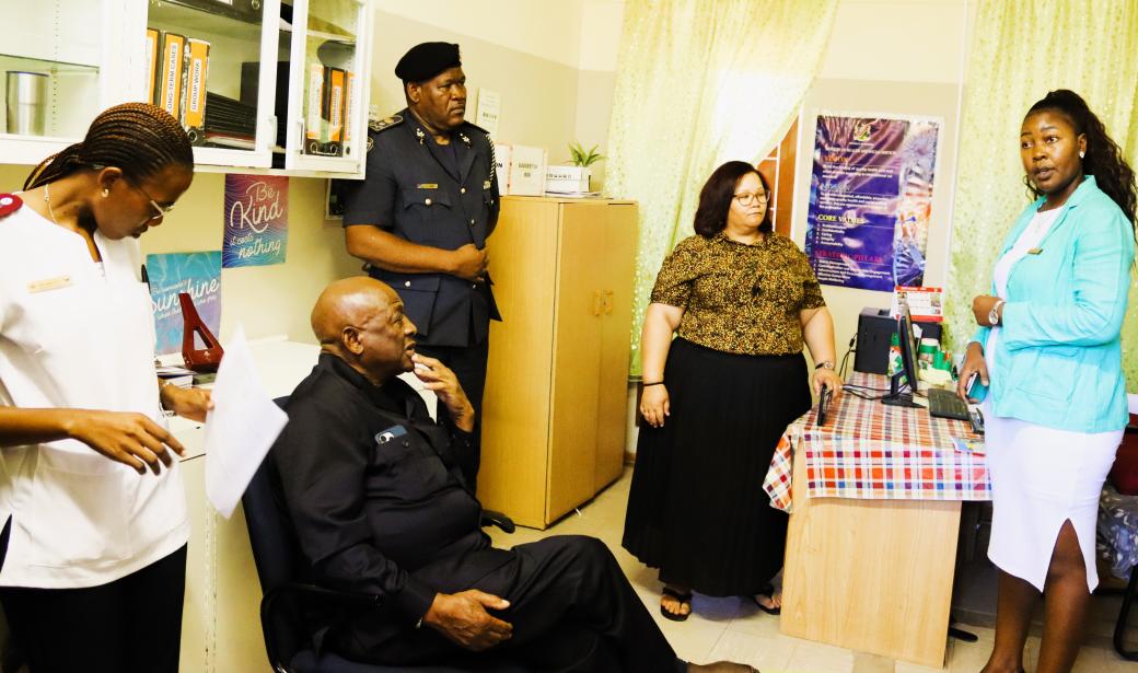 Dr. Kalumbi Shangula, Minister of Health and Social Services receiving a briefing from the Social Workers of the MOHSS and Ministry of Gender Equality, Poverty Eradication and Social Welfare in the presence of the Omaheke Police Regional Commander, Commissioner Heinrich Tjiveze 